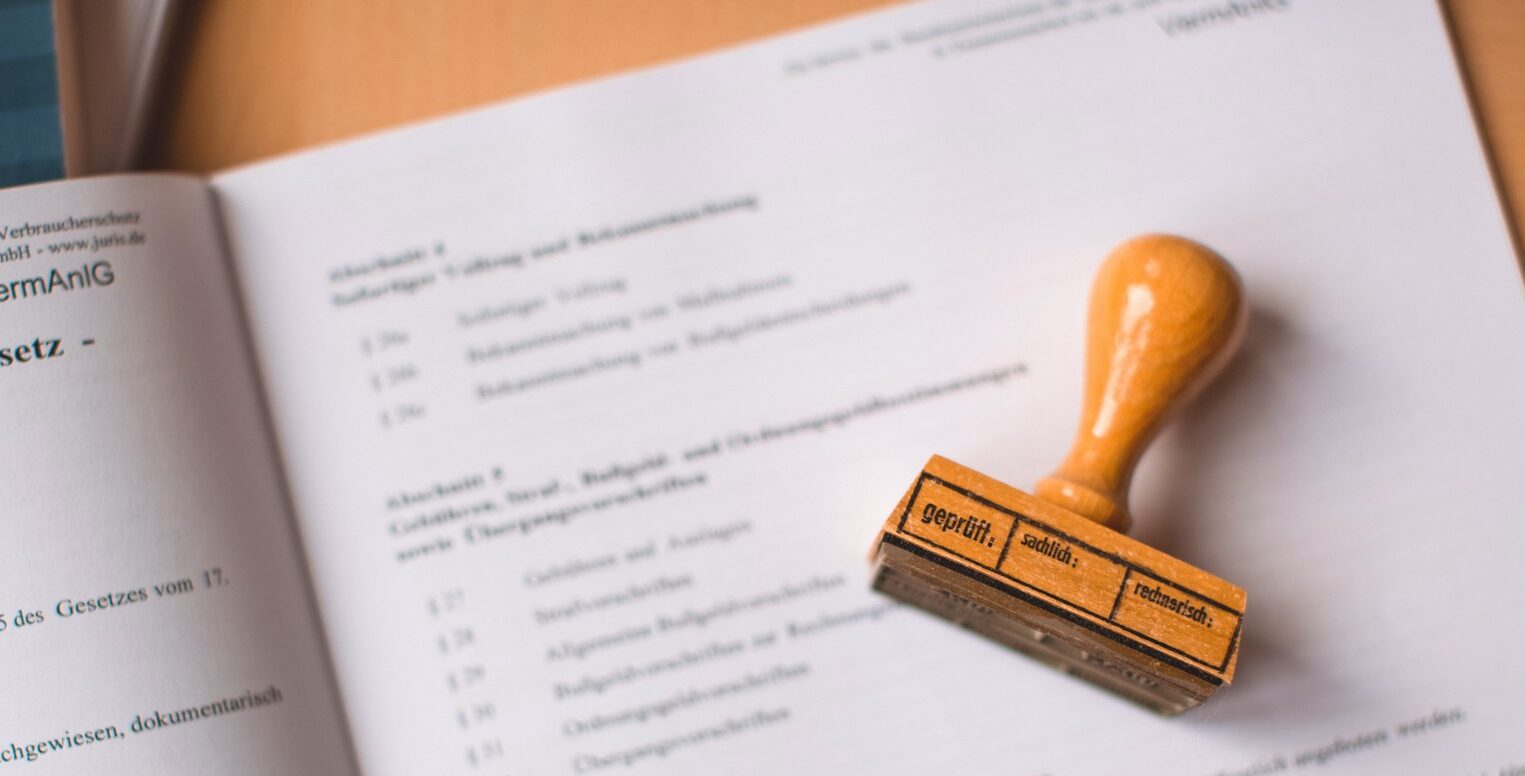 brown wooden hand tool on white printer paper